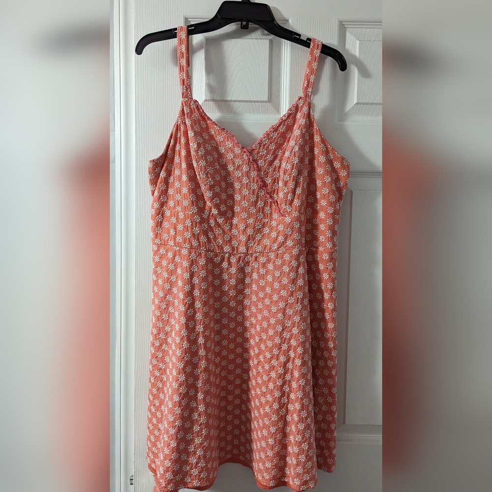 Orange sundress with delicate white flower detail